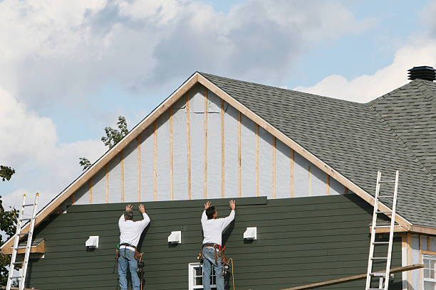 Professional Storm Damage Siding Repair technician working in Winterville, NC